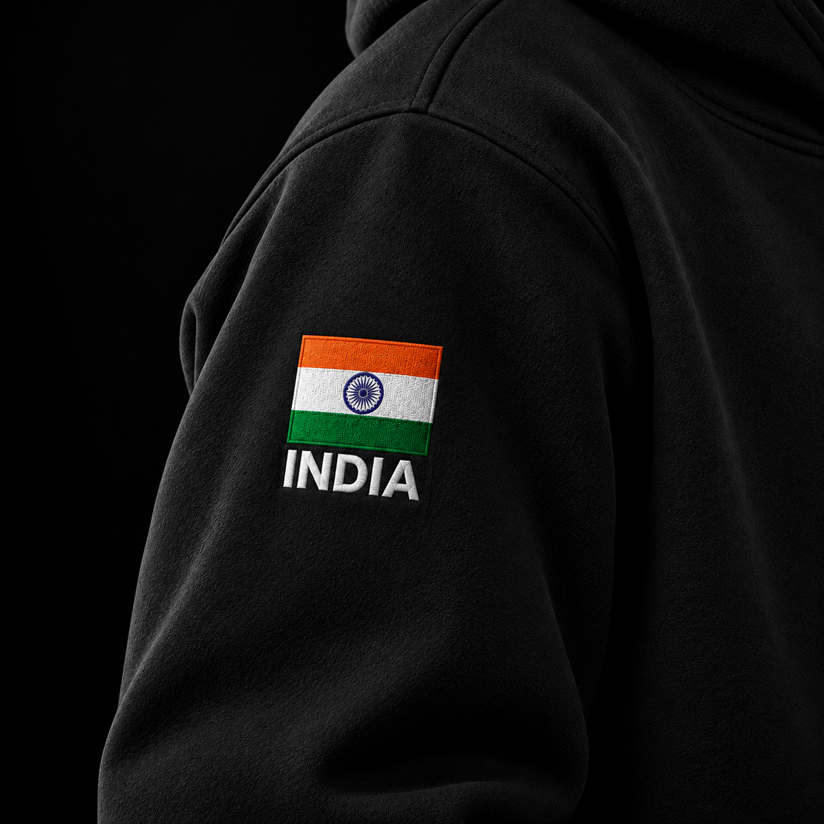 Black Army hoodie sleeve close-up showing the Indian flag patch and INDIA embroidery.