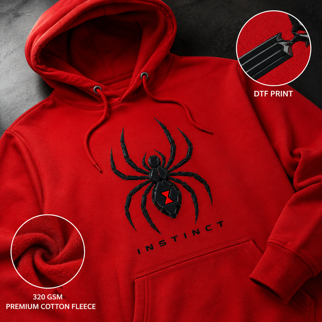 Red pullover hoodie with a large black spider graphic and the word 'INSTINCT' on the front, shown on a dark textured background with two circular inset callouts highlighting the DTF print and 320 GSM premium cotton fleece texture.