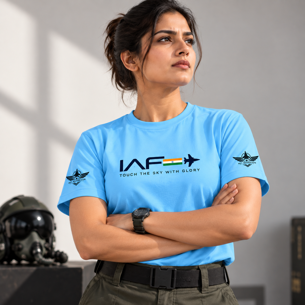 Woman wearing sky-blue airforce-inspired IAF T-shirt with tricolor jet graphic and winged sleeve emblems.