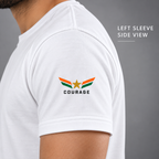 Left sleeve detail of white India Pride T-shirt with orange-and-green wing emblem, gold star and COURAGE print.